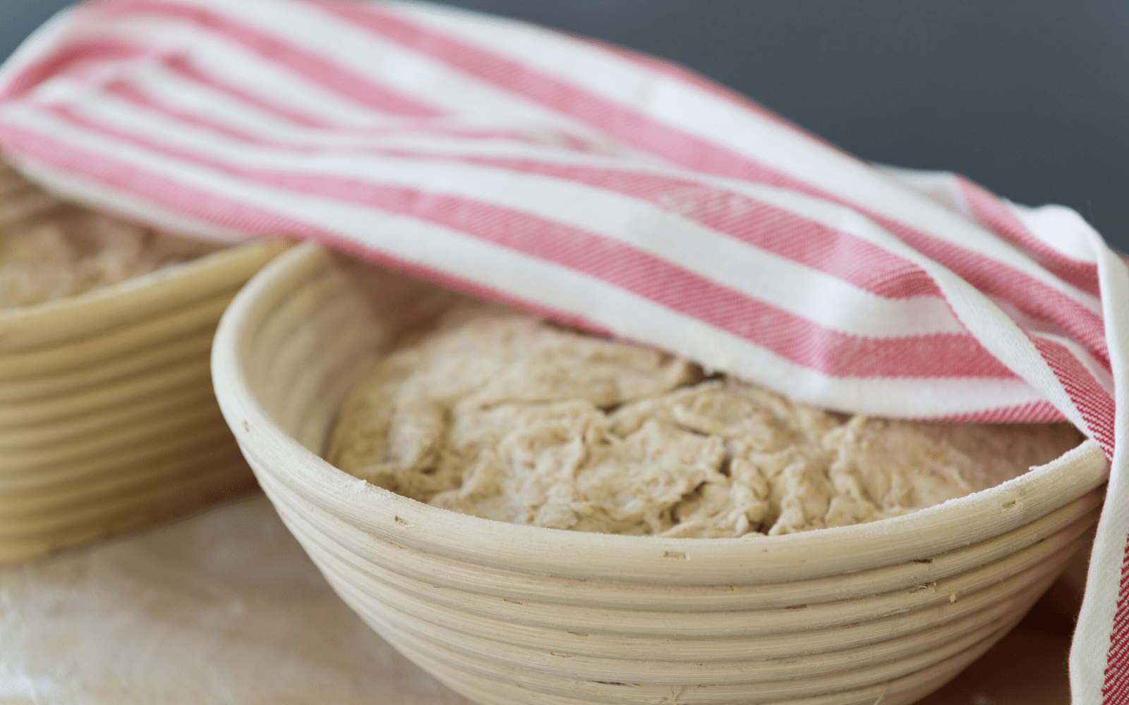 bread dough rising up in bread proofing basket australia